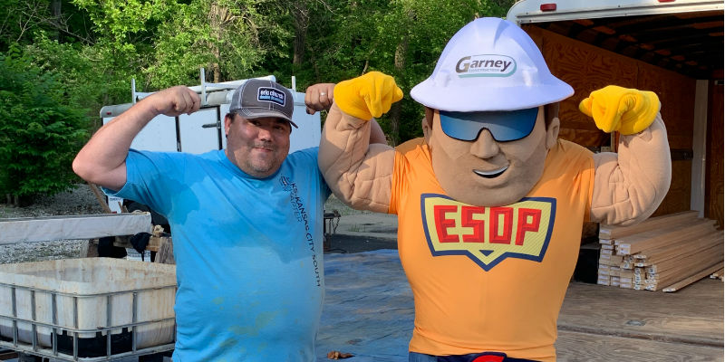 ESOP man mascot posing with employee-owner