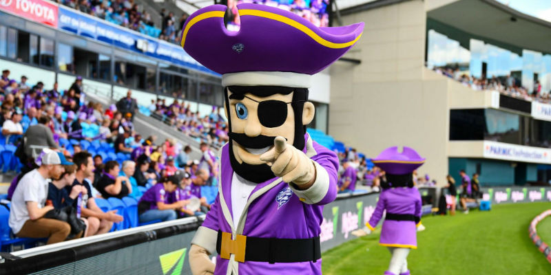 A pirate mascot pointing at the crowd