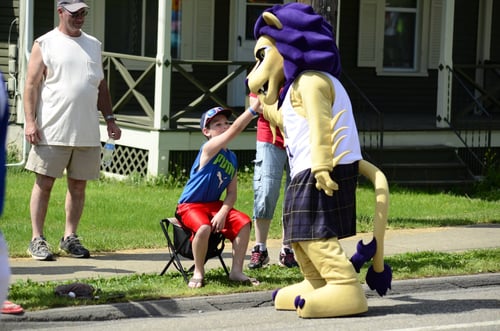 Houghton Highlander Custom Lion Mascot High Fiving a Fan