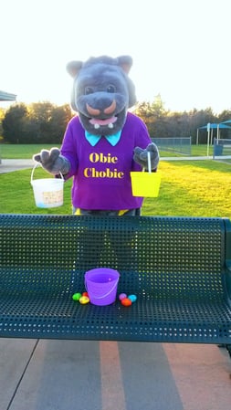 T and B Books Obie Chobie Mascot having an Easter Egg Hunt