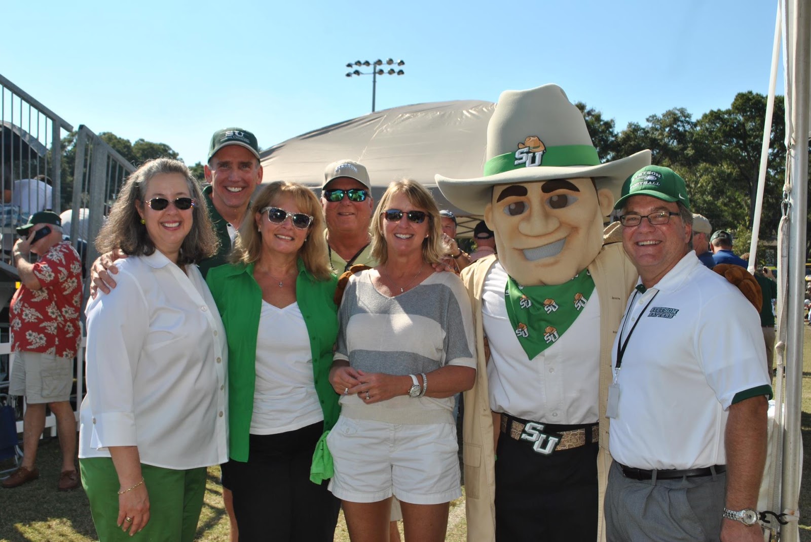 Mascot hanging out with a crowd of people at an event