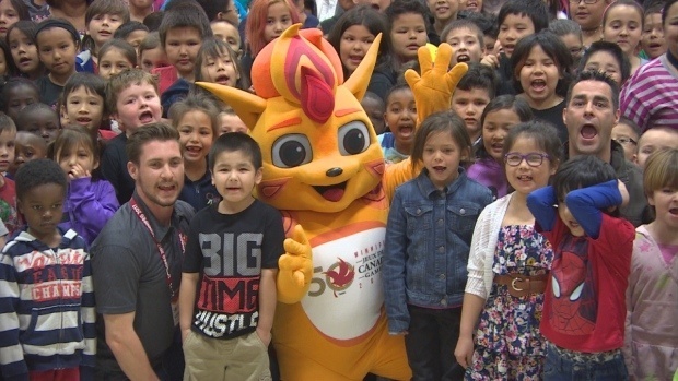 Niibin, the 2017 Canada Games mascot, with crowd